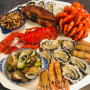 Livraison de plateau de fruits de mer avec du homard